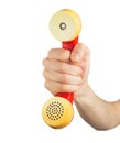 Hand holding red telephone receiver Royalty Free Stock Photo