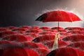 Hand holding red umbrella Among many umbrellas against the storm, sky background and black cloud group and rain,thunderstorm with Royalty Free Stock Photo