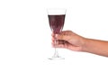 Hand holding red wine in crystal glass ready to toast Royalty Free Stock Photo