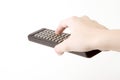 Hand holding a remote Royalty Free Stock Photo