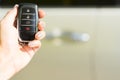 Hand holding remote car key Royalty Free Stock Photo