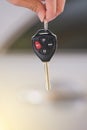 Hand holding remote car key. Royalty Free Stock Photo