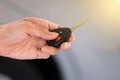 Hand holding remote car key. Royalty Free Stock Photo