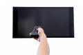 Hand holding remote control to the TV screen isolated Royalty Free Stock Photo
