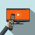 Hand holding remote control. TV icon concept. Play icon on television. Smart TV concept. Flat vector Royalty Free Stock Photo