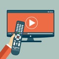 Hand holding remote control. TV icon concept. Play icon on television. Smart TV concept Royalty Free Stock Photo