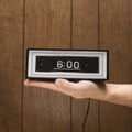 Hand holding retro clock set Royalty Free Stock Photo