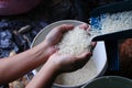 Hand holding rice from the rice mill Royalty Free Stock Photo