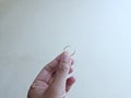 hand holding a ring ,isolated on a white background Royalty Free Stock Photo