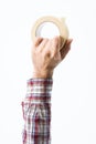 Hand holding a roll of masking tape Royalty Free Stock Photo