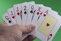 Hand holding a royal flush hearts Royalty Free Stock Photo