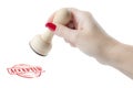 Hand holding a rubber stamp with the word accepted