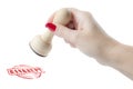 Hand holding a rubber stamp with the word bankrupt