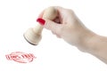 Hand holding a rubber stamp with the tekst 100% free Royalty Free Stock Photo