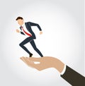 Hand holding running businessman vector Royalty Free Stock Photo