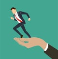 Hand holding running businessman vector