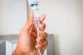 hand holding saline IV drip Royalty Free Stock Photo