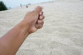 Hand holding a sand over desert sand Royalty Free Stock Photo