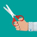 Hand holding scissors. Flat style. Royalty Free Stock Photo