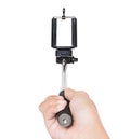 Hand holding selfie stick isolated white