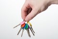 Hand holding set of colorful lock keys Royalty Free Stock Photo