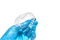 Hand is holding set of custom dental trays for bleaching teeth Royalty Free Stock Photo
