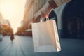 Hand holding shopping bag. Generate Ai Royalty Free Stock Photo