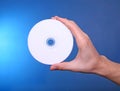 Hand holding showing cd dvd blue ray disc Royalty Free Stock Photo