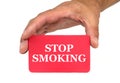Hand holding and showing a red card with STOP SMOKING text Royalty Free Stock Photo