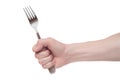 Hand holding a silver fork on an isolated white background Royalty Free Stock Photo