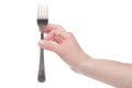 Hand holding a silver fork on an isolated white background Royalty Free Stock Photo