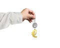 Hand holding silver key with golden euro sign shape keyring Royalty Free Stock Photo