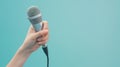 Hand Holding a Silver Microphone.AI generated image Royalty Free Stock Photo