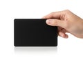 A hand holding a sleek black rectangular device with a reflective surface Royalty Free Stock Photo