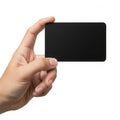 A hand holding a sleek black rectangular object against a white background Royalty Free Stock Photo