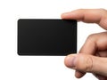 A hand holding a sleek black rectangular object against a white background Royalty Free Stock Photo