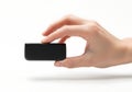 A hand holding a small black rectangular device resembling a remote control or sensor Royalty Free Stock Photo