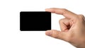 A hand holding a small black rectangular object against a white background Royalty Free Stock Photo