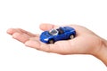 Hand holding small blue car Royalty Free Stock Photo