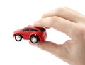 Hand holding a small red car Royalty Free Stock Photo