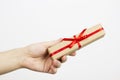 Hand holding small red present box in hands Royalty Free Stock Photo