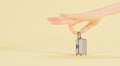 Hand holding a small suitcase lying on a yellow background, 3d rendering