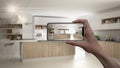 Hand holding smart phone, AR application, simulate furniture and interior design products in real home, architect designer concept