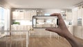 Hand holding smart phone, AR application, simulate furniture and interior design products in real home, architect designer concept Royalty Free Stock Photo