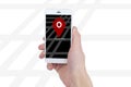 Hand holding smart phone with map gps navigation application on Royalty Free Stock Photo