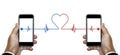 Hand holding smart phone with signal lines connection to another phone with heart shape, on white background