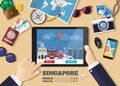 Hand holding smart tablet booking travel destination.Singapore famous places.Vector concept banners in flat style with the set of