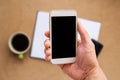 Hand is holding a smartphone with blank mockup screen Royalty Free Stock Photo