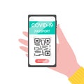 Hand holding smartphone with covid-19 vaccination passport. Electronic passport with QR code. Health passport about coronavirus an