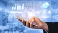 Hand Holding Smartphone with Digital Charts and Graphs Displayed, Showcasing Modern Data Analysis and Business Royalty Free Stock Photo